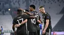 Penyerang Manchester United, Marcus Rashford (kedua kanan) berselebrasi usai mencetak gol ke gawang Real Sociedad pada leg pertama babak 32 besar Liga Europa di stadion Juventus, Turin (19/2/2021). MU menang telak atas Sociedad 4-0. (Marco Alpozzi/LaPresse via AP)
