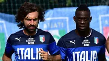 Andrea Pirlo dan Mario Balotelli (GIUSEPPE CACACE / AFP)