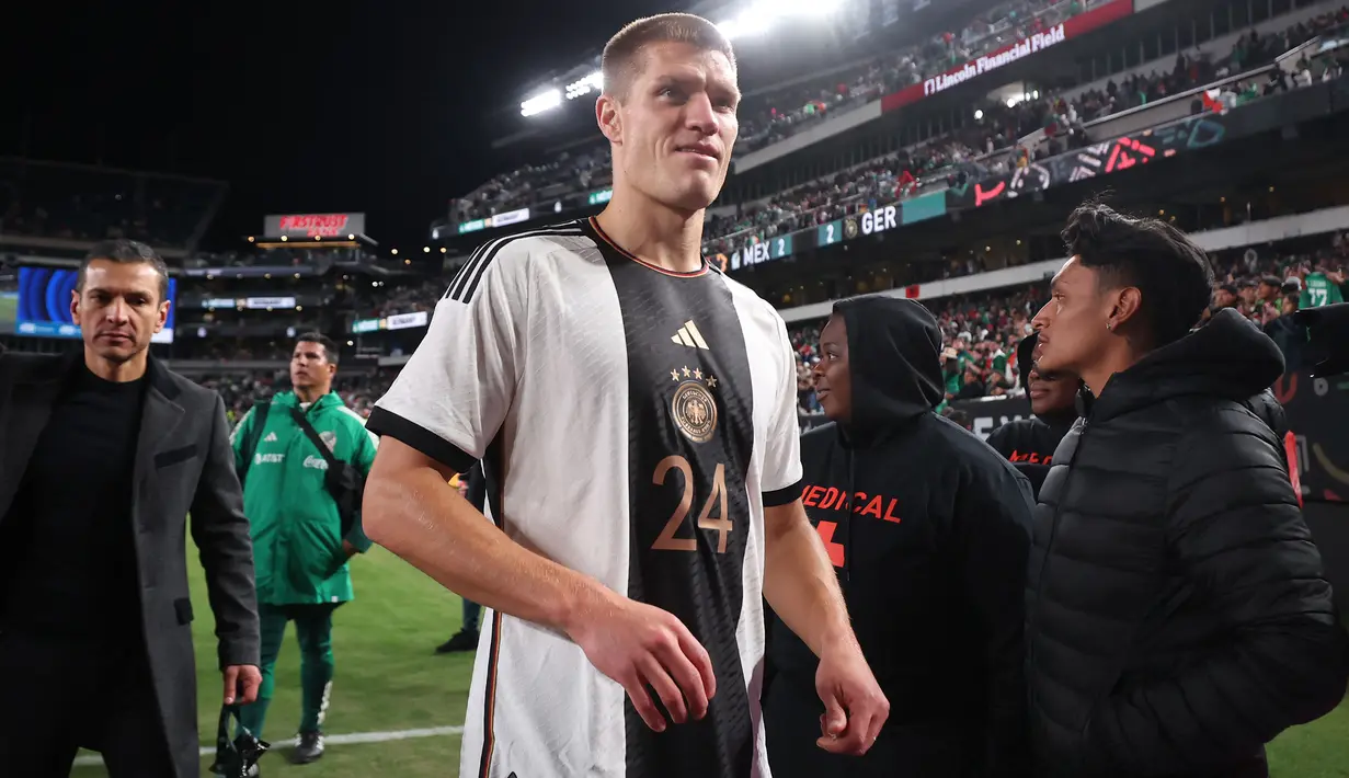 Kevin Behrens yang kini berusia 32 tahun dan tengah membela Union Berlin baru menjalani debut bersama Timnas Jerman saat menghadapi Meksiko pada laga persahabatan (18/10/2023). Dalam laga yang berakhir dengan hasil imbang 2-2, Kevin Behrens tampil sejak menit ke-87 menggantikan Jamal Musiala. (AFP/Getty Images/Alex Grimm)