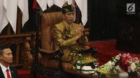 Presiden Joko Widodo dengan baju adat suku Sasak NTB menyampaikan pidato kenegaraan dalam Sidang Bersama DPD-DPR di Kompleks Parlemen, Senayan, Jakarta, Jumat (16/8/2019). Setelah sidang tahunan MPR 2019 berakhir, agenda berlanjut ke sidang bersama DPD-DPR. (Liputan6.com/Johan Tallo)