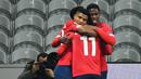 Pemain Lille merayakan gol yang dicetak Jonathan Bamba ke gawang AC Milan laga lanjutan Liga Europa di Stade Pierre Mauroy, Jumat (27/11/2020) dini hari WIB. AC Milan bermain imbang 1-1 menghadapi Lille. (AFP/Dennis Charlet/pool)