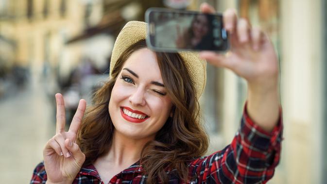 Ilustrasi selfie (iStockphoto)