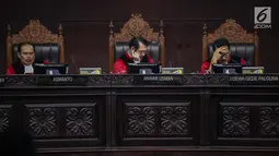 Ekpresi majelis hakim saat memimpin sidang putusan sengketa Pilpres 2019 di Gedung Mahkamah Konstitusi (MK), Jakarta, Kamis (27/6/2019). MK akan membacakan putusan sengketa Pilpres 2019 yang dimohonkan kubu Prabowo-Sandiaga. (Liputan6.com/Faizal Fanani)