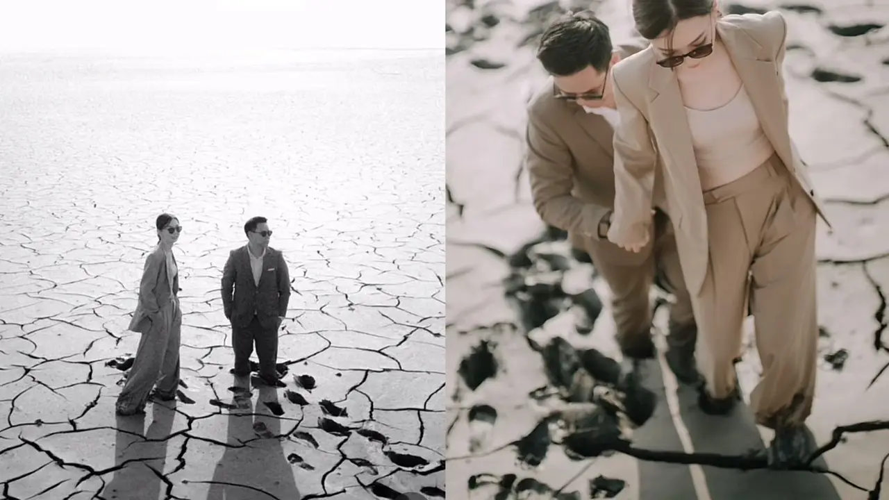 Pasangan calon pengantin sedang berpose untuk foto prewedding yang mengambil lokasi di lumpur lapindo