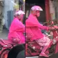 Aksi emak-emak viral dengan motornya yang serba warna pink. (TikTok/@meandcup)