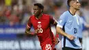 Selebrasi striker Timnas Kanada, Jonathan David setelah mencetak gol kedua timnya ke gawang Timnas Uruguay pada laga perebutan tempat ketiga Copa America 2024 di Bank of America Stadium, Charlotte, Amerika Serikat, Minggu (14/7/2024) pagi WIB. (AP Photo/Nell Redmond)