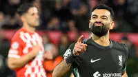 Penyerang Liverpool, Mohamed Salah merayakan golnya saat pertandingan matchday 6 Liga Champions 2024/2025 melawan Girona FC di stadion Montilivi, Girona pada Selasa 10 Desember 2024 waktu setempat atau Rabu 11 Desember 2024 dini hari Waktu Indonesia Barat. (Josep LAGO/AFP)