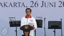 Presiden Jokowi saat memberi sambutan di acara peringatan Hari Anti Narkotika Internasional (HANI) di kawasan Taman Sari, Jakarta, Minggu (26/6). Peringatan HANI merupakan wujud kepedulian terhadap ancaman narkoba. (Liputan6.com/Herman Zakharia)