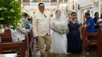 Topan Wipha adalah badai ketiga tahun ini, namun pasangan di Filipina tetap memilih melangsungkan pernikahan di tengah banjir (Dok. Gereja&nbsp;Barasoain).