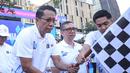 Flag off fun walk Hari Kekayaan Intelektual Sedunia 2026 dilakukan sekitar pukul 06.00 WIB. Menteri Hukum Supratman Andi Agtas membuka secara langsung kegiatan tersebut dengan mengibarkan bendera tanda funwalk dimulai. (Bola.com/Abdul Aziz)