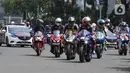 Parade pembalap MotoGP di kawasan Bundaran HI, Jakarta, Rabu (16/3/2022). Sebanyak 20 pembalap ikut ambil bagian. Sebagian besar merupakan rider yang akan tampil pada MotoGP Mandalika, 18-20 Maret 2022. (Liputan6.com/Herman Zakharia)