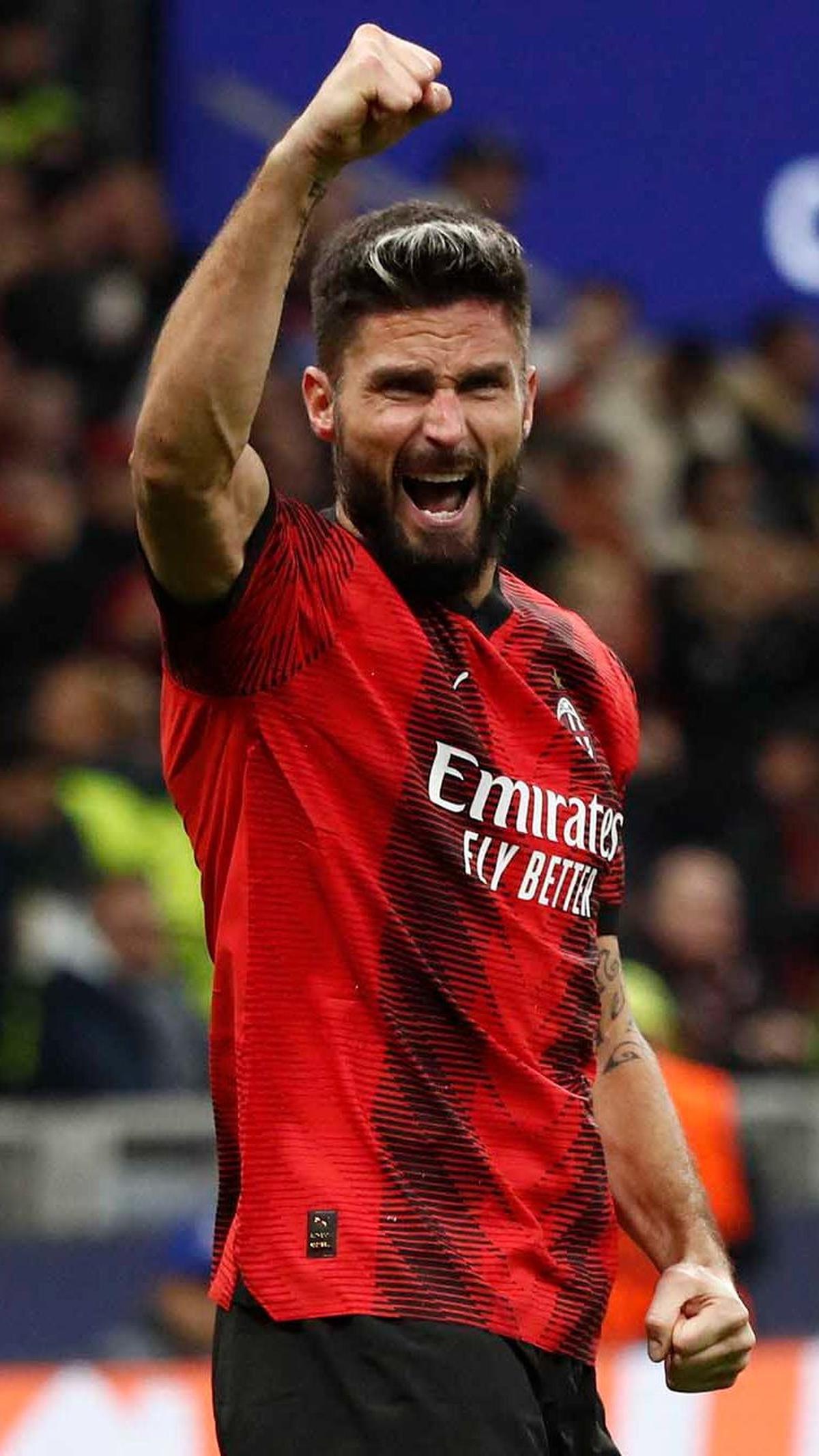 Ekspresi Giroud merayakan golnya untuk AC MIlan yang sekaligus menjadi penentu kemenangan.&nbsp;REUTERS/Alessandro Garofalo