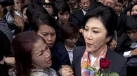 Mahkamah Konstitusi (MK) Thailand memutuskan bahwa Yingluck wajib mengundurkan diri dari jabatannya atas kasus penyalahgunaan kekuasaan. (AFP PHOTO/Pornchai Kittiwongsakul) 