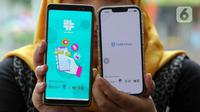Warga menunjukkan aplikasi SatuSehat Mobile di Jakarta, Rabu (1/3/2023). Terdapat artikel-artikel maupun kampanye kesehatan dari Kementerian Kesehatan pada aplikasi SatuSehat Mobile. (Liputan6.com/Herman Zakharia)