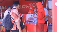 SPG Rokok berjilbab di arena Muktamar NU, Jombang, Jawa Timur (Liputan6.com/Taufiqurrohman)