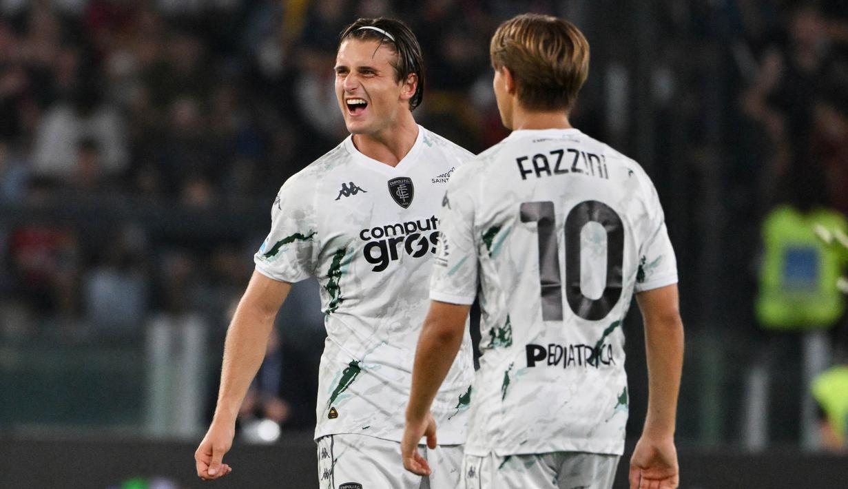 Empoli berhasil menggandakan keunggulan lewat gol Lorenzo Colombo yang dicetak dari titik putih pada menit ke-60. (Alberto PIZZOLI/AFP)