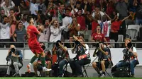 Striker Portugal, Andre Silva, merayakan gol ke gawang Italia pada laga UEFA Nations League, di Stadion Da Luz, Lisbon, Senin (10/9/2018). (AFP/Francisco Leong)