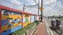 Mural bertema 'Tolak Kekerasan Perempuan dan Pelecehan Seksual' di kawasan Jatinegara, Jakarta, Senin (17/12). Mural tersebut juga mengajak masyarakat untuk melindungi kaum perempuan. (Merdeka.com/Iqbal S. Nugroho)