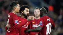 Pemain Liverpool Mohamed Salah (tengah) merayakan golnya ke gawang Red Bull Salzburg bersama Sadio Mane (kanan) dan Roberto Firmino (kiri) pada lanjutan Liga Champions di Stadion Anfield, Liverpool, Inggris, Rabu (2/10/2019). The Reds menang tipis 4-3 atas Salzburg. (AP Photo/Jon Super)