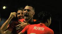 Selebrasi Marko Simic setelah mencetak gol pertama Persija ke gawang Madura United dalam semifinal Piala Gubernur Jatim 2020 di Stadion Kanjuruhan, Kabupaten Malang (17/2/2020). (Bola.com/Iwan Setiawan)