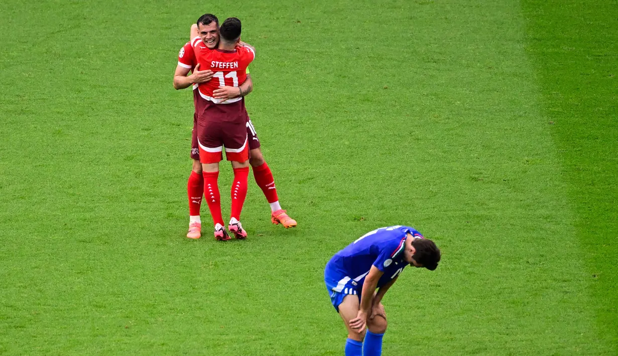 Hingga akhir pertandingan, skor tidak berubah 2-0 untuk kemenangan Swiss. (JOHN MACDOUGALL/AFP)