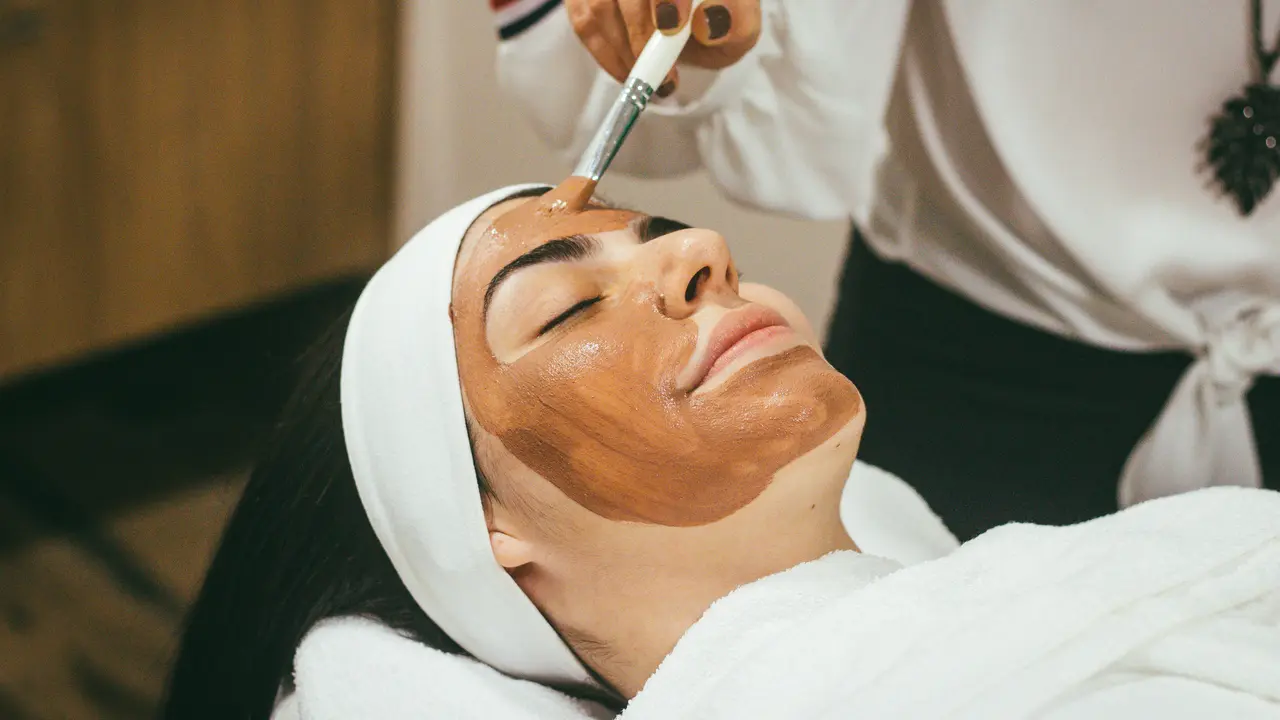 Woman with clay mask
