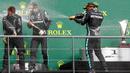 Pembalap Mercedes, Lewis Hamilton, melakukan selebrasi usai menjuarai balapan F1 GP Belgia di Sirkuit Spa-Francorchamps, Minggu (30/8/2020). Lewis Hamilton finis pertama dengan catatan waktu 1 jam 24 menit 8,761 detik. (Francois Lenoir/Pool Photo via AP)