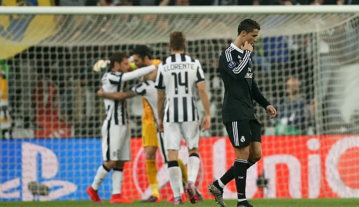 Juventus akhirnya berhasil mengunci kemenangan 2-1 atas Real Madrid. (AFP PHOTO/MARCO BERTORELLO)