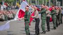 Prajurit TNI dan Polri berkolaborasi memainkan rampak gendang dalam HUT ke-73 Bhayangkara di Monas, Jakarta, Rabu (10/7/2019). HUT Bhayangkara ke-73 ini bertemakan ‘Dengan semangat Promoter, pengabdian Polri, untuk masyarakat, bangsa, dan negara. (Liputan6.com/Faizal Fanani)
