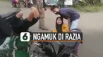 Video seorang pengendara motor perempuan mengamuk di jalan saat di razia petugas polisi karena tidak memakai masker dan helm.
