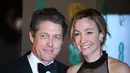 Hugh Grant dikabarkan akan menikahi wanita yang sudah lama dipacarinya, Anna Eberstein. (Justin TALLIS / AFP)