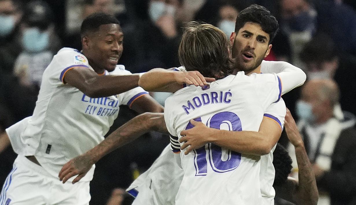 Real Madrid berhasil menggandakan keunggulan menjadi 2-0 pada menit ke-57. Tembakan Marco Asensio ke arah tiang jauh tidak mampu dijangkau Jan Oblak. (AP/Bernat Armangue)