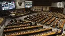 Suasana Rapat Paripurna pengesahan RUU Omnibus Law Cipta Kerja menjadi UU di Kompleks Parlemen, Senayan, Jakarta, Senin (5/10/2020). Fraksi Partai Demokrat dan PKS menolak pengesahan, sementara tujuh fraksi lainnya menyetujui RUU Omnibus Law Cipta Kerja menjadi UU. (Liputan6.com/Johan Tallo)
