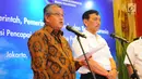 Gubernur BI Perry Warjiyo (kiri) memberi keterangan terkait target devisa pariwisata, Jakarta, Senin (18/3). Pemerintah dan BI menyepakati 6 langkah strategis mendorong penerimaan devisa pariwisata 2019. (Liputan6.com/Angga Yuniar)