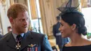Pangeran Harry benar-benar mencintai Meghan Markle. Meski ia ingin miliki anak, namun Pangeran Harry tak ingin terburu-buru. (CHRIS J RATCLIFFE / POOL / AFP)