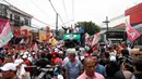 Mantan presiden Brasil (2003-2010) dan kandidat presiden dari Partai Buruh (PT) berhaluan kiri, Luiz Inacio Lula da Silva (kiri), kandidat wakil presiden Brasil Geraldo Alckmin (tengah) dan kandidat Gubernur Sao Paulo Fernando Haddad ambil bagian dalam sebuah kampanye di Sao Mateus, Negara Bagian Sao Paulo, Brasil, Senin (17/10/2022). Lula da Silva dan presiden Jair Bolsonaro akan menghadapi putaran kedua pemilihan presiden pada 30 Oktober, dengan ekspektasi persaingan ketat mendorong kedua belah pihak untuk mengintensifkan kampanye di putaran kedua. (Miguel SCHINCARIOL / AFP)