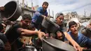 Kantor Perserikatan Bangsa Bangsa (PBB) untuk Koordinasi Urusan Kemanusiaan (OCHA) mengatakan sekitar 2,1 juta orang di Jalur Gaza terancam kelaparan. (BASHAR TALEB/AFP)