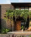 Desain Fasad Rumah dengan Roster dan Tanaman Gantung (created by AI)