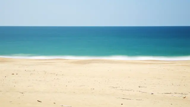 Ilustrasi pasir laut (Foto: Unsplash/Lopez Robin)