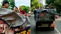Video belasan remaja pria mandi bareng di sebuah dump truck yang melintas di Jalan Raya Sragen-Solo viral di media sosial. (Liputan6.com/ istimewa)
