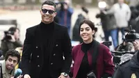 Georgina Rodriguez mendampingi Cristiano Ronaldo usai sidang terkait pajak di Madrid pada Januari 2019. (AFP/Pierre-Philippe Marcou)