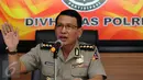 Kabagpenum Humas Polri Kombes Pol Martinus Sitompul menyampaikan keterangan di Mabes Polri, Jakarta, Jumat (24/3). Keterangan terkait perkembangan kasus penangkapan terduga teroris di Ciwandan, Cilegon, Banten. (Liputan6.com/Helmi Fithriansyah)