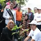 Wali Kota Surabaya Tri Rismaharini hadiri festival tabebuya pada Minggu, 1 Desember 2019. (Foto: Liputan6.com/Dian Kurniawan)