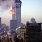 Foto file asap dan api meletus dari menara kembar World Trade Center setelah pesawat komersial sengaja menabrak gedung-gedung di Manhattan, New York pada 11 September 2001. (AFP/Seth Mcallister)