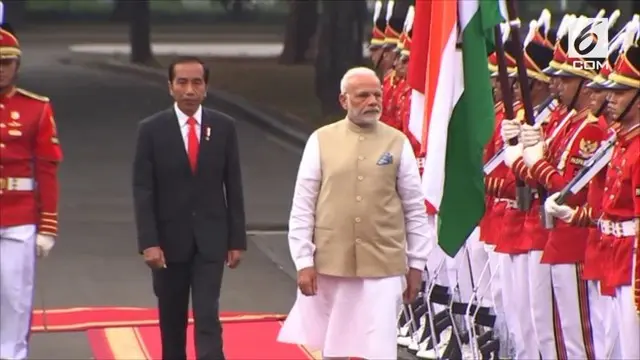 Presiden Joko Widodo atau Jokowi menyambut kedatangan Perdana Menteri India, Narendra Modi, di Istana Merdeka, Jakarta, Rabu (30/5/2018).