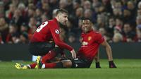Striker Manchester United, Anthony Martial, mengalami cedera saat takluk 0-2 dari Paris Saint-Germain pada leg pertama 16 besar Liga Champions di Old Trafford, Selasa (12/2/2019) waktu setempat. (AP Photo/Dave Thompson)