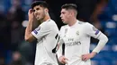 Gelandang Real Madrid, Marco Asensio (kiri) bereaksi selama laga terakhir Grup G Liga Champions melawan CSKA Moscow di Santiago Bernabeu, Rabu (12/12). Real Madrid secara mengejutkan dipecundangi CSKA Moscow 0-3. (JAVIER SORIANO / AFP)