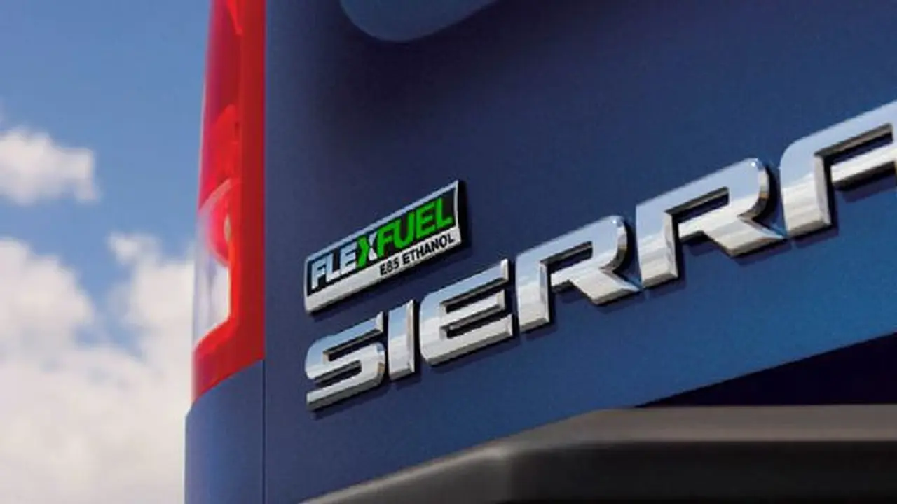 Ilustrasi mobil dengan emblem bahan bakar fleksibel