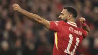 Liverpool's Mohamed Salah celebrates after scoring his side's second goal during the Champions League soccer match between Liverpool and Bologna at the Anfield stadium in Liverpool, England, Wednesday, Oct. 2, 2024. (AP Photo/Ian Hodgson)