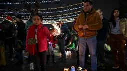 Hari Lilin Kecil adalah perayaan tradisional Kolombia untuk memperingati Kesucian Maria. (Juan BARRETO/AFP)